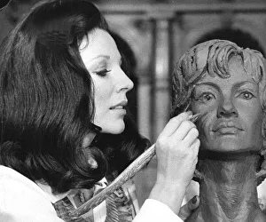 Joan Collins working on a clay bust during filming at Elstree Studios Joan Collins working on a clay bust during filming at Elstree Studios