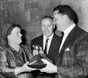 Jock Stein receives a trophy from Mrs Bessie Braddock for the manager of the year award Jock Stein receives a trophy from Mrs Bessie Braddock for the manager of the year award