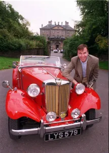 Joe ODonnell January 1999 With his MG car red sports car Joe ODonnell January 1999 With his MG car red sports car