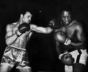 John Conteh Boxer lands a left hook to David Matthews Jaw during their fight John Conteh Boxer lands a left hook to David Matthews Jaw during their fight