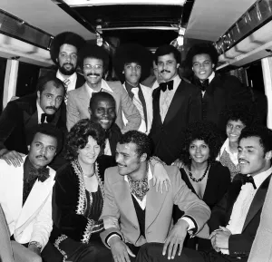 John Conteh celebrates with family aboard a playboy motor coach after winning world title John Conteh celebrates with family aboard a playboy motor coach after winning world title