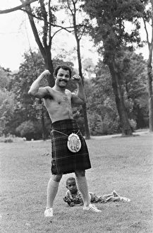 John Conteh gets the Scottish flavour on Parliament Hill Fields today watched by curious John Conteh gets the Scottish flavour on Parliament Hill Fields today watched by curious