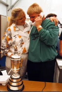 John Daly phones home to his parents in the USA watched by his wife Paulette after John Daly phones home to his parents in the USA watched by his wife Paulette after