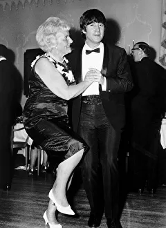 John Lennon dancing with Mrs Louise Harrison mother of George Harrison at the Dorchester John Lennon dancing with Mrs Louise Harrison mother of George Harrison at the Dorchester