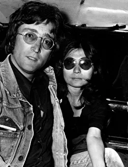 JOHN LENNON AND YOKO ONO IN LIMO AFTER ARRIVING AT LAP FROM MAJORCA JOHN LENNON AND YOKO ONO IN LIMO AFTER ARRIVING AT LAP FROM MAJORCA