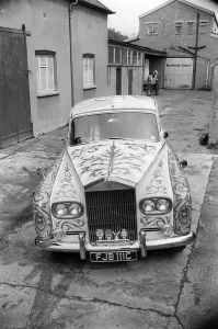 John Lennon's psychedelically painted Rolls-Royce leaves the car paint shop of J.P John Lennon's psychedelically painted Rolls-Royce leaves the car paint shop of J.P
