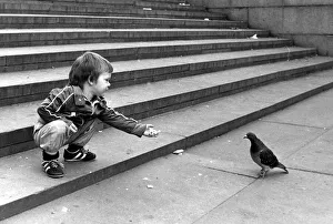 John Milller feeding a pigeon in Trafalger Square. September 30th 1983 John Milller feeding a pigeon in Trafalger Square. September 30th 1983