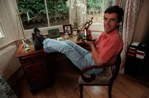John Satpleton TV Presenter September 1998 At home sitting on his desk John Satpleton TV Presenter September 1998 At home sitting on his desk