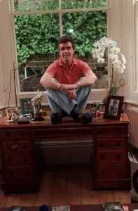 John Stapleton TV Presenter September 1998 At home sitting on his desk John Stapleton TV Presenter September 1998 At home sitting on his desk