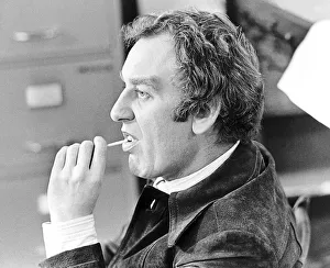 John Thaw during filming of The Sweeney 1975 with lollipop sweet John Thaw during filming of The Sweeney 1975 with lollipop sweet