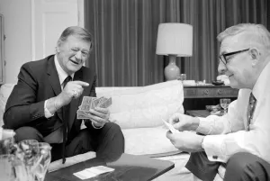 John Wayne pictured relaxing playing cards in his suite at The Connaught Hotel, Mayfair John Wayne pictured relaxing playing cards in his suite at The Connaught Hotel, Mayfair