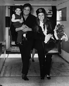 Johnny Cash singer with wife June Carter in London 1971 with son John Cash Johnny Cash singer with wife June Carter in London 1971 with son John Cash
