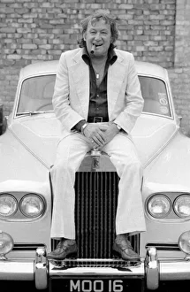 Johnny Speight TV Script Writer - sitting on the bonnet of his Rolls Royce A© Johnny Speight TV Script Writer - sitting on the bonnet of his Rolls Royce A©