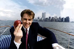 Jonathan Ross TV Presenter on a boat on the Hudson river in New York holding an apple Jonathan Ross TV Presenter on a boat on the Hudson river in New York holding an apple