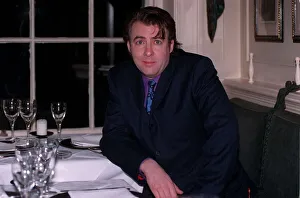 Jonathan Ross TV Presenter December 1997 Siting at table A©mirrorpix Jonathan Ross TV Presenter December 1997 Siting at table A©mirrorpix