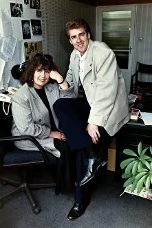 Images Dated 6th February 1989: Jonathan Ross TV Presenter sitting on desk with his mother Maureen