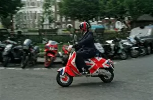Images Dated 13th July 1998: Jonathon Ross TV Presenter August 1998 Riding his Union Jack painted Vespa scooter