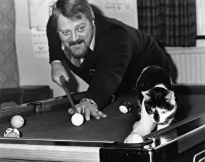 Judd the cat playing pool with landlord Brian Nevin at the pub in Eckington, Derbyshire Judd the cat playing pool with landlord Brian Nevin at the pub in Eckington, Derbyshire