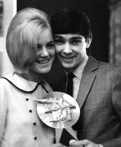 Judi Johnson presents the Super National Getaway trophy to American singer Gene Pitney Judi Johnson presents the Super National Getaway trophy to American singer Gene Pitney