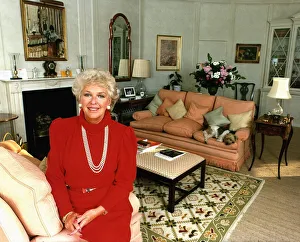 Katie Boyle columnist relaxing at home wearing red top Katie Boyle columnist relaxing at home wearing red top
