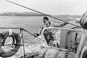 Keeping a lookout during exercises of the Barry lifeboat in the Bristol Channel is crew Keeping a lookout during exercises of the Barry lifeboat in the Bristol Channel is crew