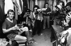 Kenny Dalglish celebrates with champagne in the dressing room as Liverpool win the league Kenny Dalglish celebrates with champagne in the dressing room as Liverpool win the league