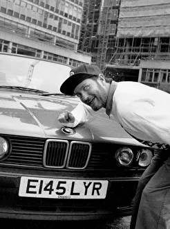 Kenny Everett sitting with his new BMW car 21/07/1989 Kenny Everett sitting with his new BMW car 21/07/1989