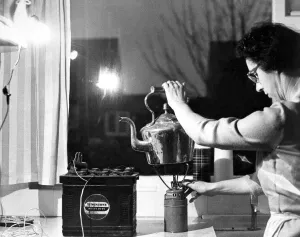 In the kitchen a spare car battery and a headlamp bulb give enough light to work in In the kitchen a spare car battery and a headlamp bulb give enough light to work in