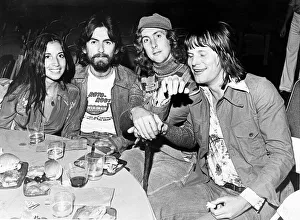 L-R Olivia Arias, Former Beatle George Harrison, Eric Idle L-R Olivia Arias, Former Beatle George Harrison, Eric Idle