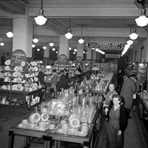 Ladies look at crockery and glasses for sale during the January sales in Kensington High Ladies look at crockery and glasses for sale during the January sales in Kensington High