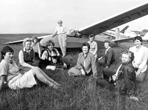The ladies from the Women's Institute wait for their turn to take to the skies in a The ladies from the Women's Institute wait for their turn to take to the skies in a