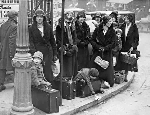 Ladies with their young charges await the bus to take them on their holidays at Easter Ladies with their young charges await the bus to take them on their holidays at Easter