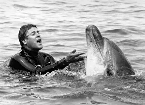 Lakeman and Percy the dolphin frolic together. July 1984 P011844 Lakeman and Percy the dolphin frolic together. July 1984 P011844