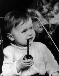 Lee Goult (17 months) smokes his cherrywood pipe, his father Allan Goult says he was Lee Goult (17 months) smokes his cherrywood pipe, his father Allan Goult says he was