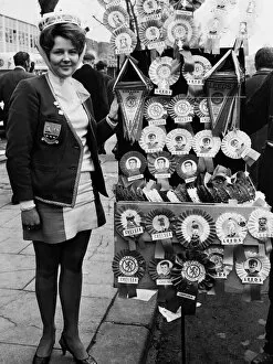Images Dated 11th April 1970: Leeds United supporter Mrs Barbra Pewte seen here standing beside a rosette stall outside