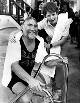 Images Dated 29th November 1986: Leisure complex attendant Phillipa Seccombe helps David Bellamy out of the pool at