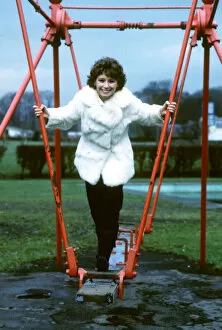Images Dated 1st February 1980: Lena Zavaroni Singer standing on swing Dbase MSI