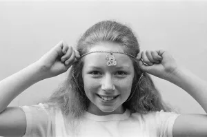 Lena Zavaroni wears a Daily Mirror Pop Club T-Shirt and a Daily Mirror Pop Club Pendant Lena Zavaroni wears a Daily Mirror Pop Club T-Shirt and a Daily Mirror Pop Club Pendant