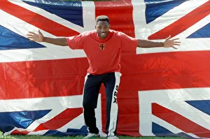Lennox Lewis poses with a hug England flag ahead of his WBC world title fight with Tony Lennox Lewis poses with a hug England flag ahead of his WBC world title fight with Tony