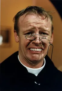 Les Dennis Comedian and TV presenter in one of his comedy roles as a vicar Les Dennis Comedian and TV presenter in one of his comedy roles as a vicar