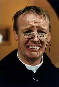 Les Dennis Comedian and TV presenter in one of his comedy roles as a vicar Les Dennis Comedian and TV presenter in one of his comedy roles as a vicar