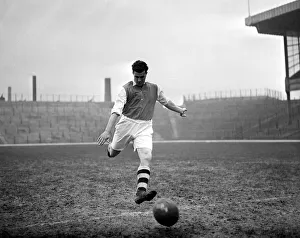 Leslie Compton kicks a football at Highbury Arsenal footballer circa 1935 Leslie Compton kicks a football at Highbury Arsenal footballer circa 1935