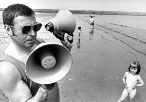 Lifeguard Thomas Todd of the Inshore Rescue boat at Roker with the tow way megaphones Lifeguard Thomas Todd of the Inshore Rescue boat at Roker with the tow way megaphones