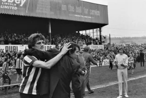 Lincoln manager Graham Taylor and star player Percy Freeman celebrate takes to the pitch Lincoln manager Graham Taylor and star player Percy Freeman celebrate takes to the pitch