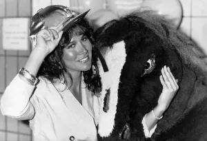 Linda Lusardi model actress standing with pantomime horse Linda Lusardi model actress standing with pantomime horse