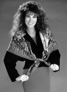 Linda Lusardi Model Ex Page 3 girl wearing a scarf over a jumper and a skirt Linda Lusardi Model Ex Page 3 girl wearing a scarf over a jumper and a skirt