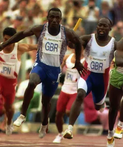 Linford Christie athlete carries baton in a relay Linford Christie athlete carries baton in a relay