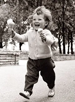 Little girl enjoying ice cream. Circa 1950 Little girl enjoying ice cream. Circa 1950