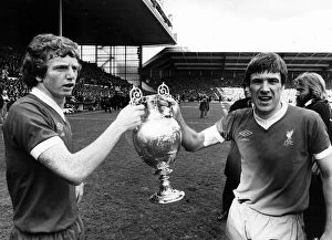 Images Dated 14th May 1977: Liverpool captain Emlyn Hughes and David Fairclough celebrate with the League