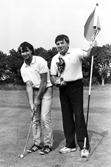 Liverpool comedian Jimmy Tarbuck is pictured presenting the trophy to John Kelley after Liverpool comedian Jimmy Tarbuck is pictured presenting the trophy to John Kelley after